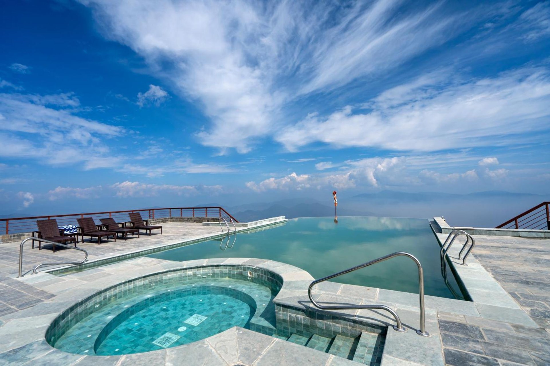 a swimming pool on the roof of a house at Chandragiri Hills Resort Kathmandu-Luxury in the Clouds in Thānkot