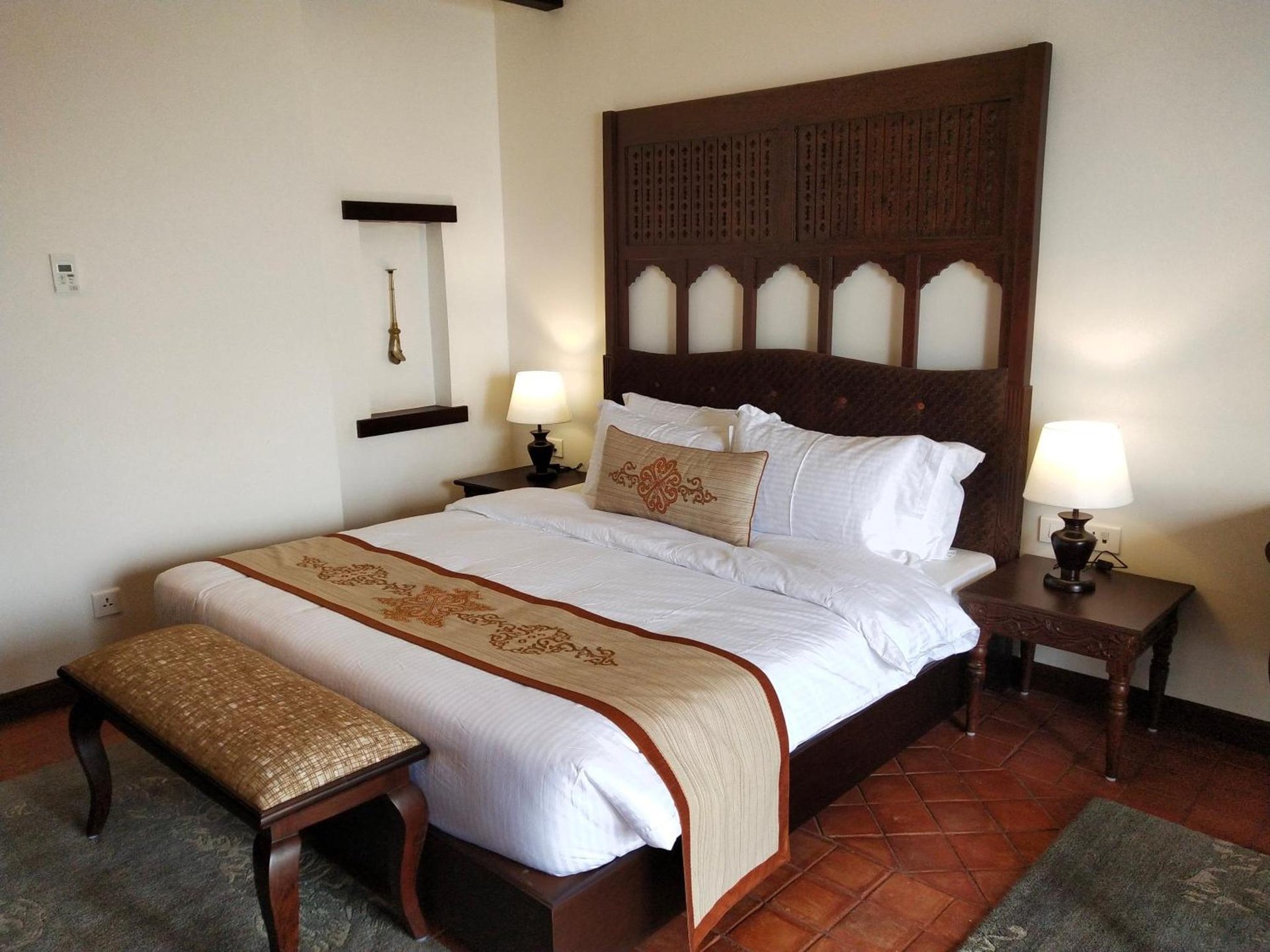 a bedroom with a large bed with a large headboard at Chandragiri Hills Resort Kathmandu-Luxury in the Clouds in Thānkot