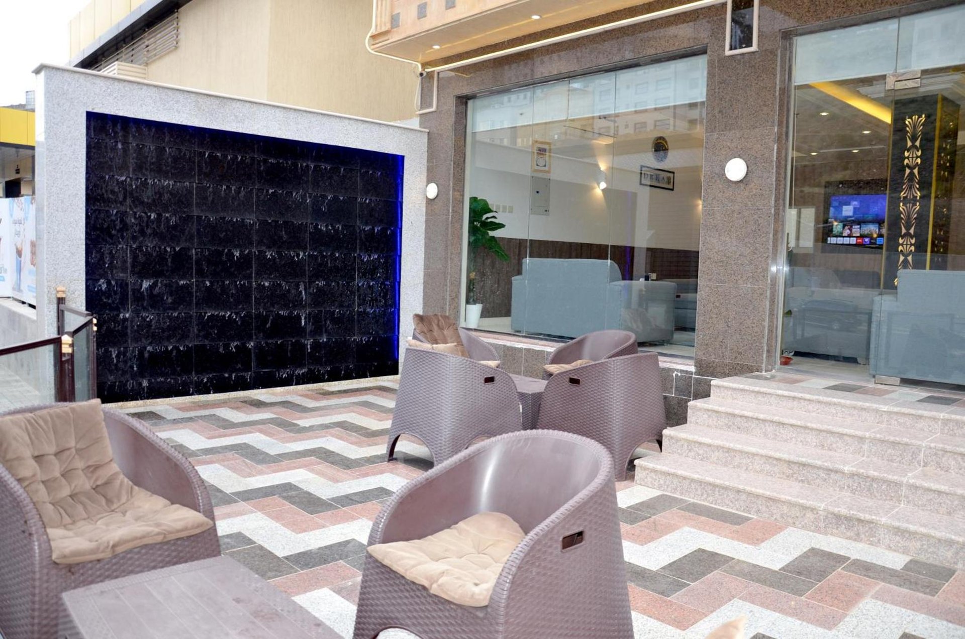 a lobby with chairs and stairs in a building at فندق فربيون ابها - Ferbion Hotel Abha in Abha