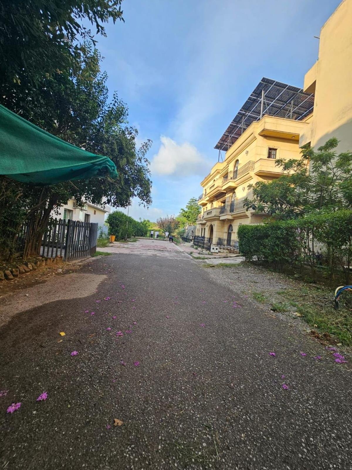an empty street in front of a building with solar panels at Hotel Best Eastern Islamabad in Islamabad