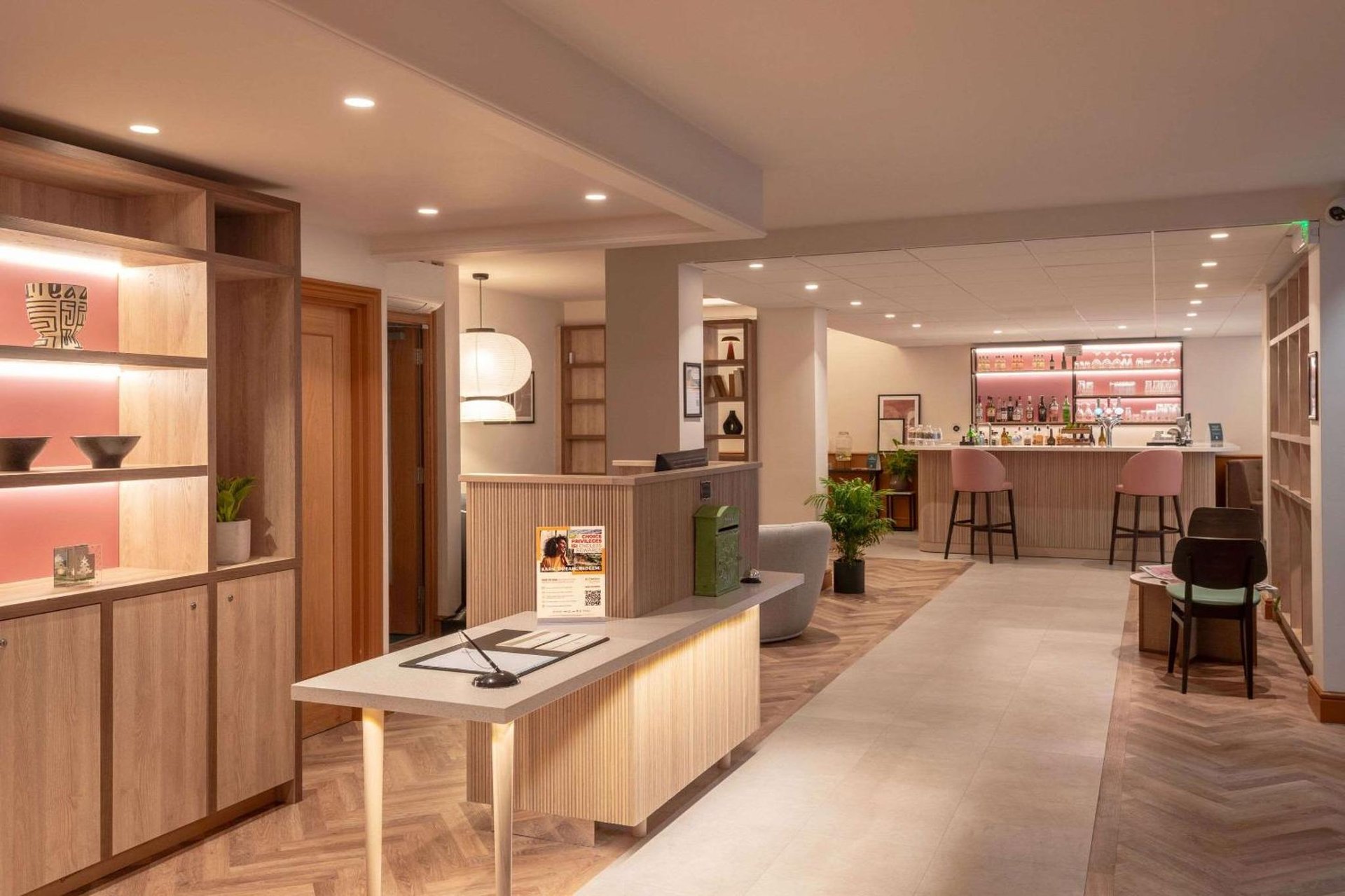 a store lobby with a table and a bar at Quality Hotel Hampstead in London