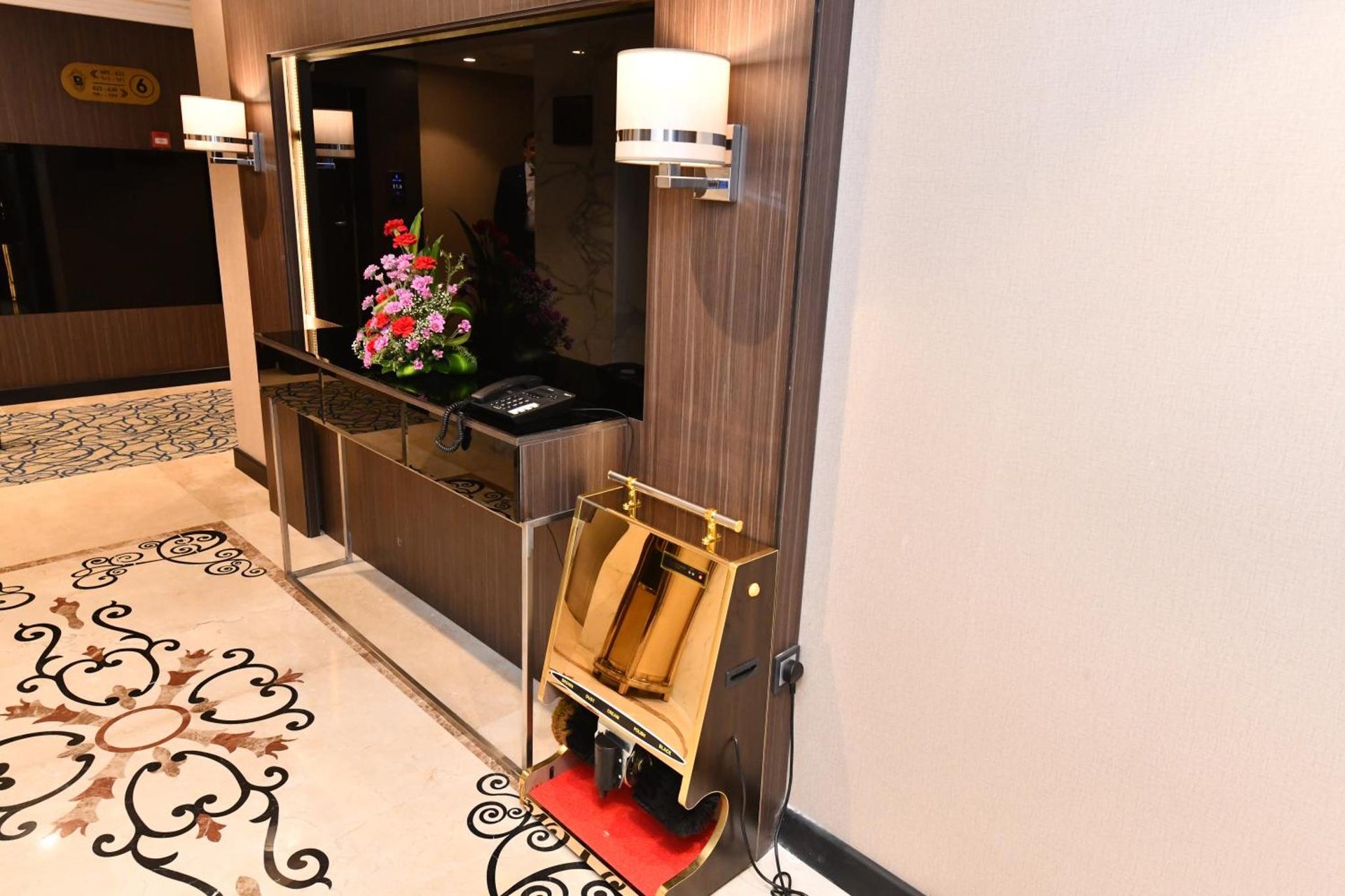 a hotel room with a lobby with a mirror at Casablanca Hotel Jeddah in Jeddah