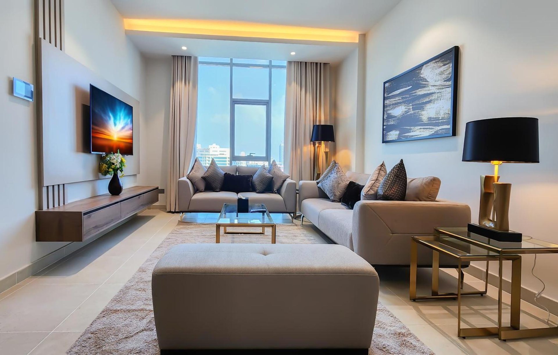a living room with a couch and a table at Farhan Tower in Juffair