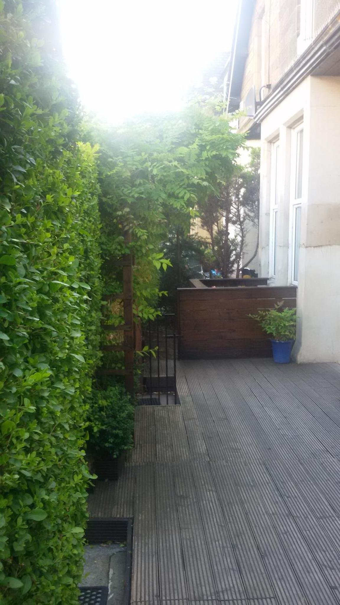 a patio with chairs and plants on a building at Leith House in Edinburgh