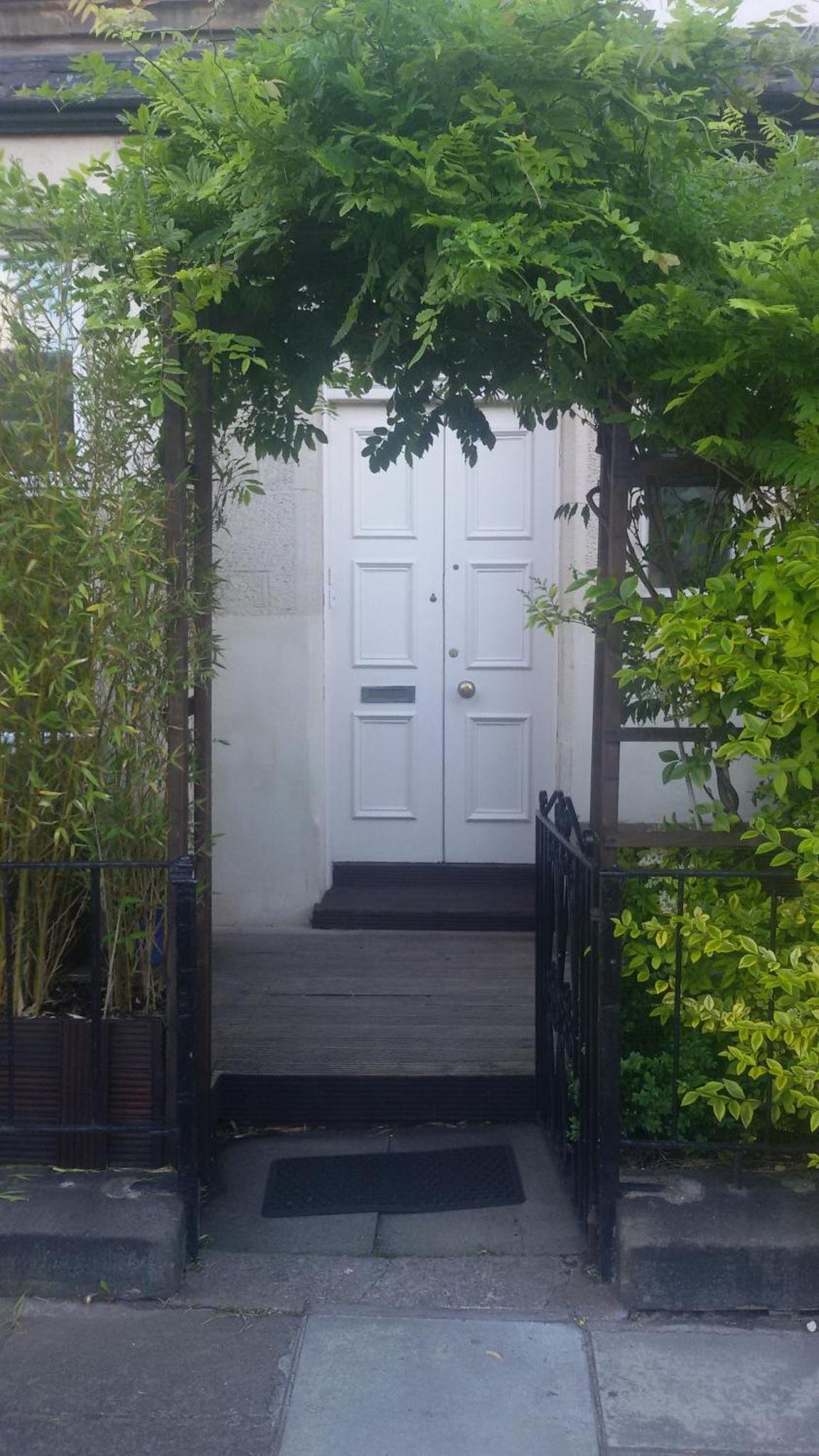 an entrance to a house with a white door at Leith House in Edinburgh