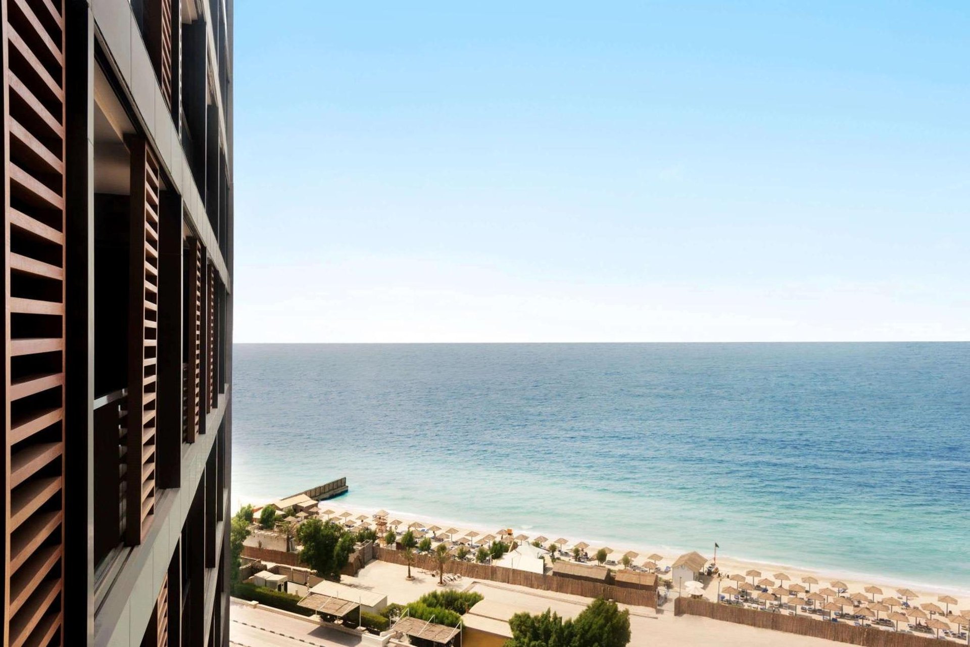 a view of the ocean from a building at Wyndham Garden Ajman Corniche in Ajman 
