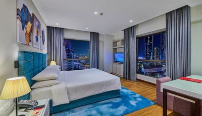 Two-Bedroom Suite with Balcony and Partial Sea View