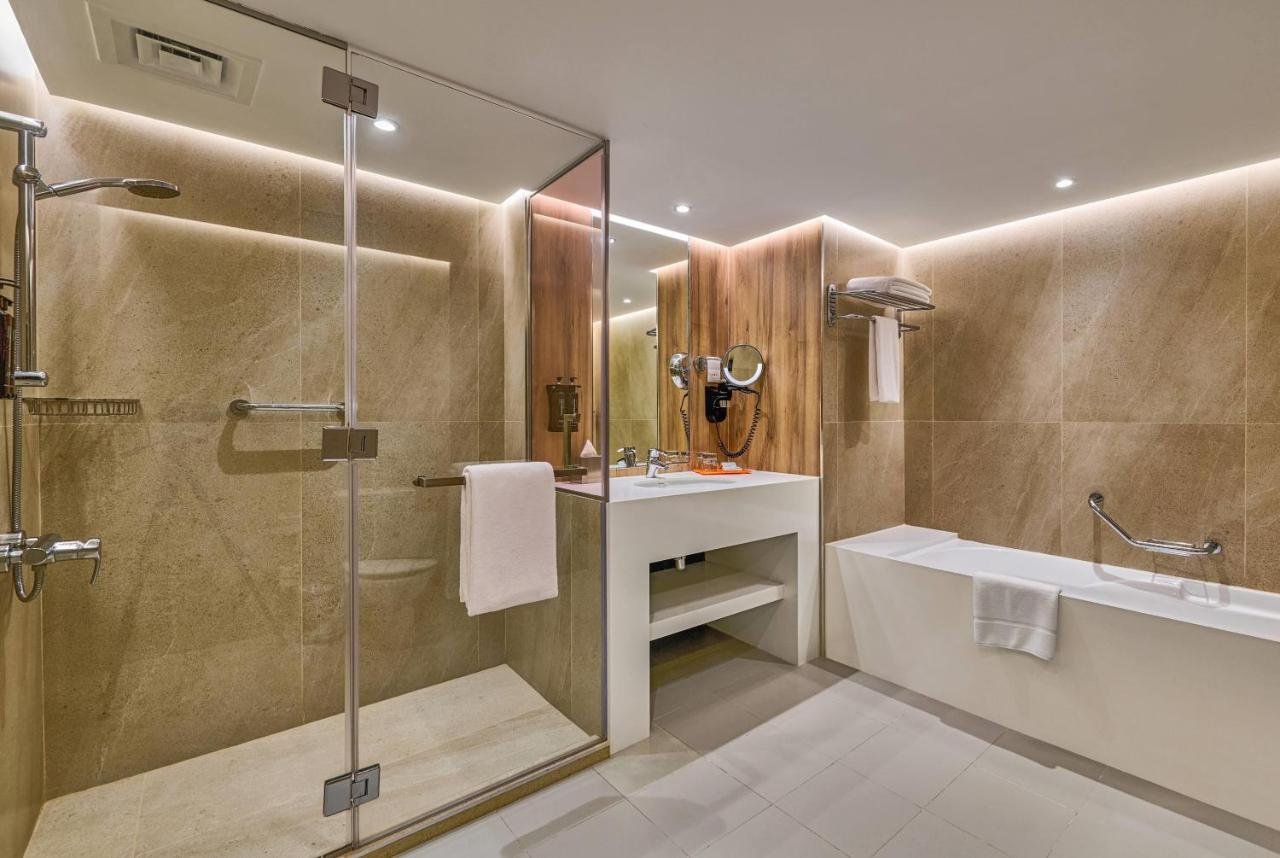 Photo of Two-Bedroom Suite with Balcony and Partial Sea View #1