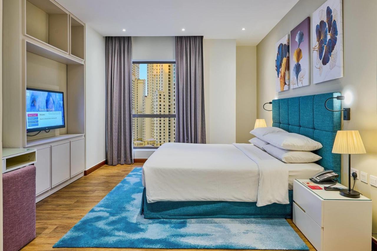 Photo of One-Bedroom King Suite with Balcony and City View #2