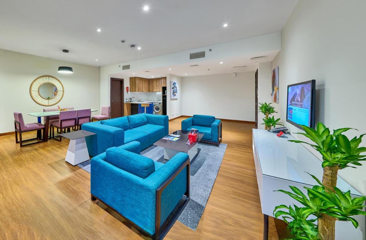 Two-Bedroom Suite with Balcony and Partial Sea View