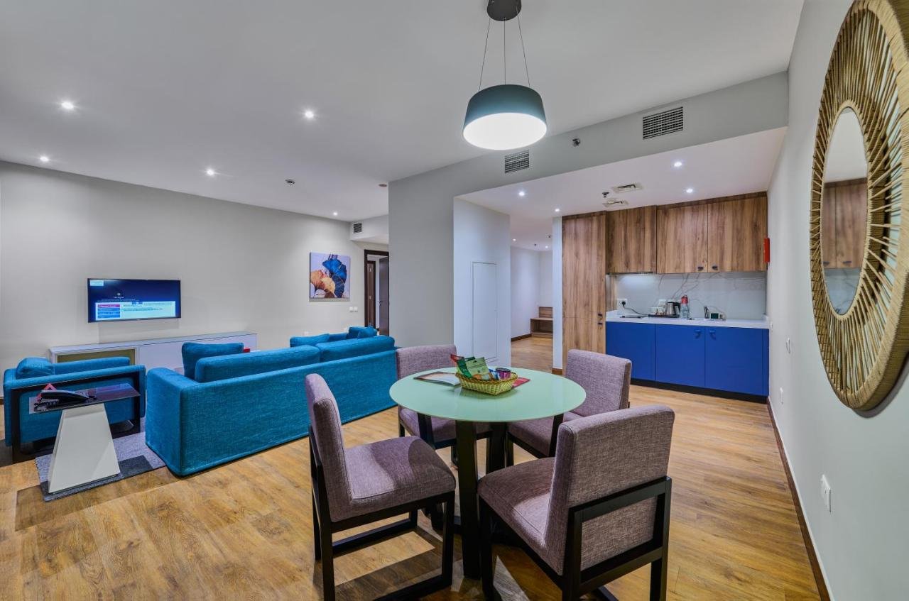 Photo of One-Bedroom King Suite with Balcony and Partial Sea View #1