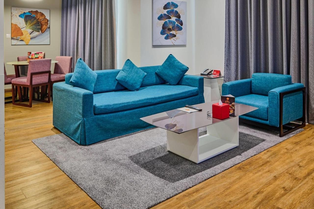Photo of One-Bedroom King Suite with Balcony and City View #1